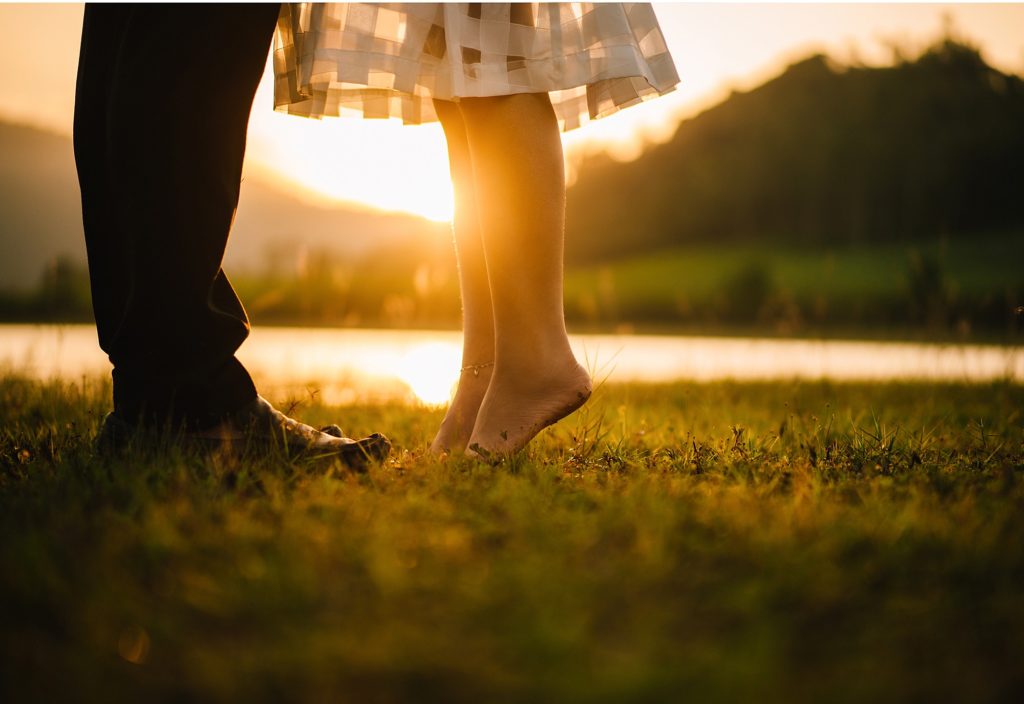 Healthy Marriage: Wife on tip toes to give husband a kiss